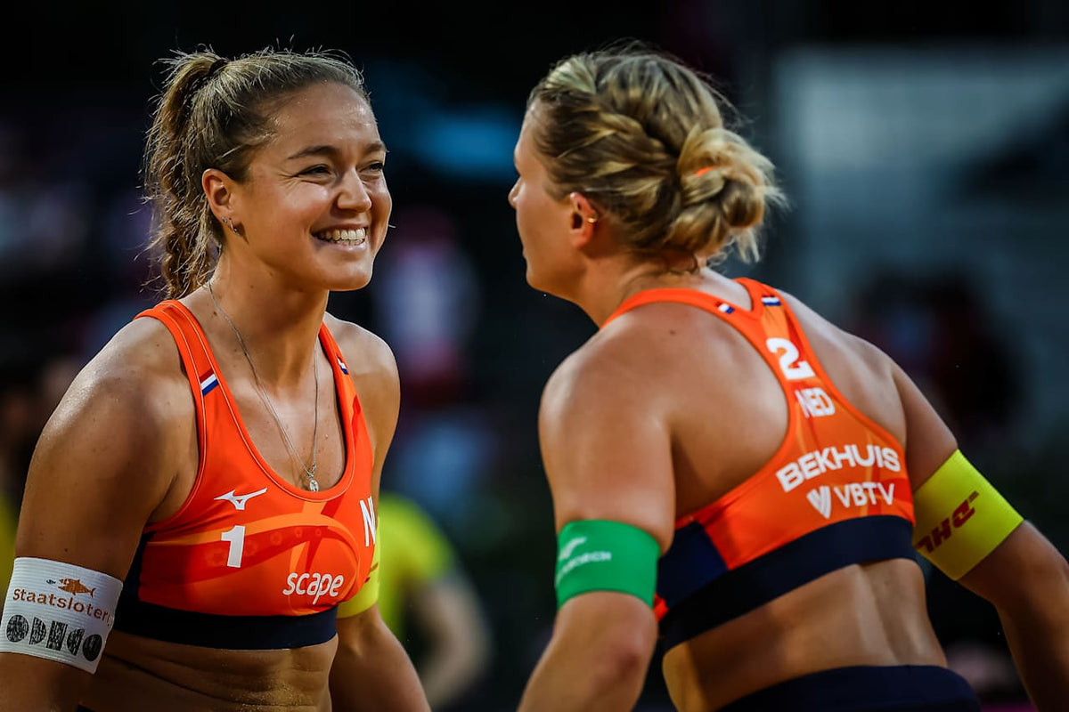 Emi van Driel with her teammate on court, beach volleyball