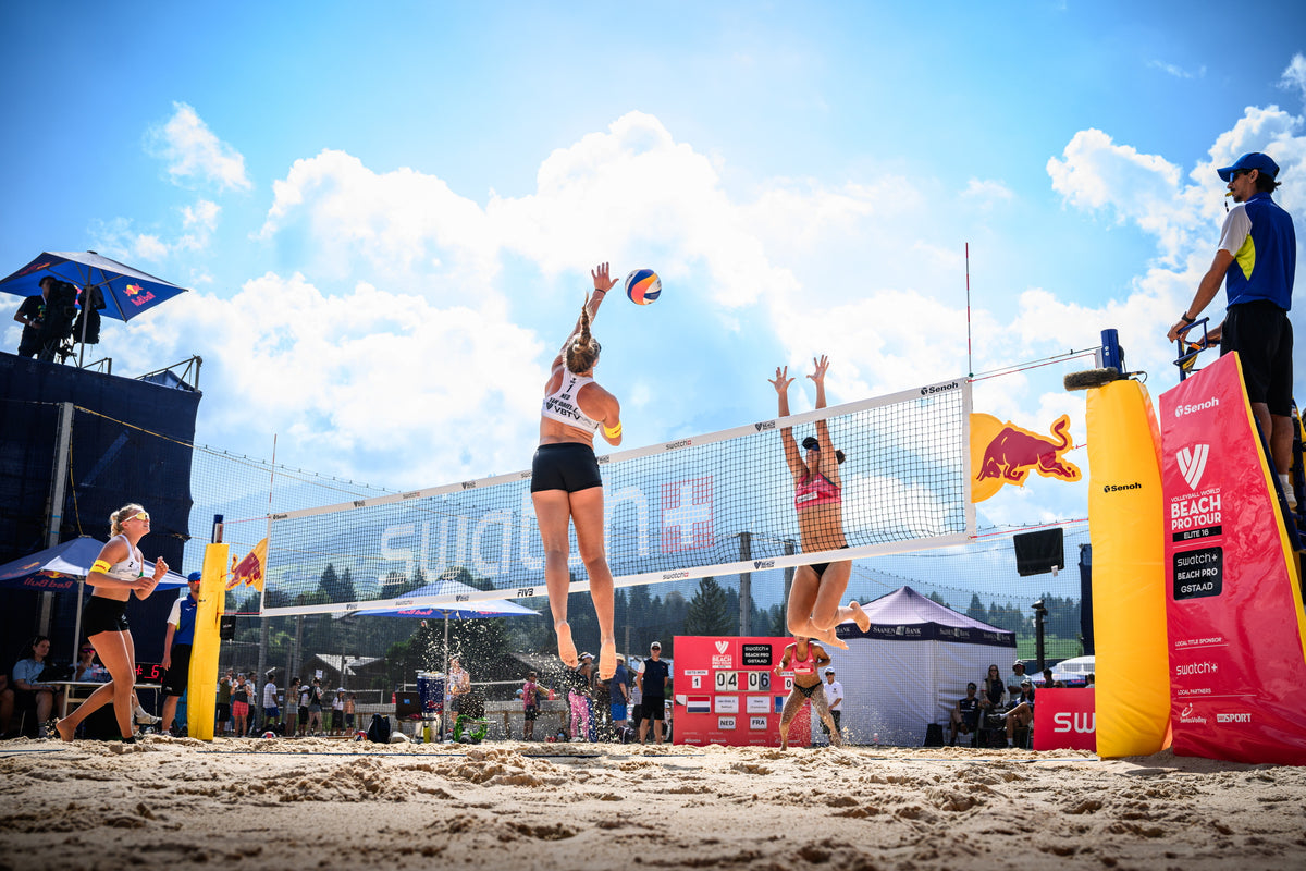 Emi van Driel jumping at the net during a beach volleyball match